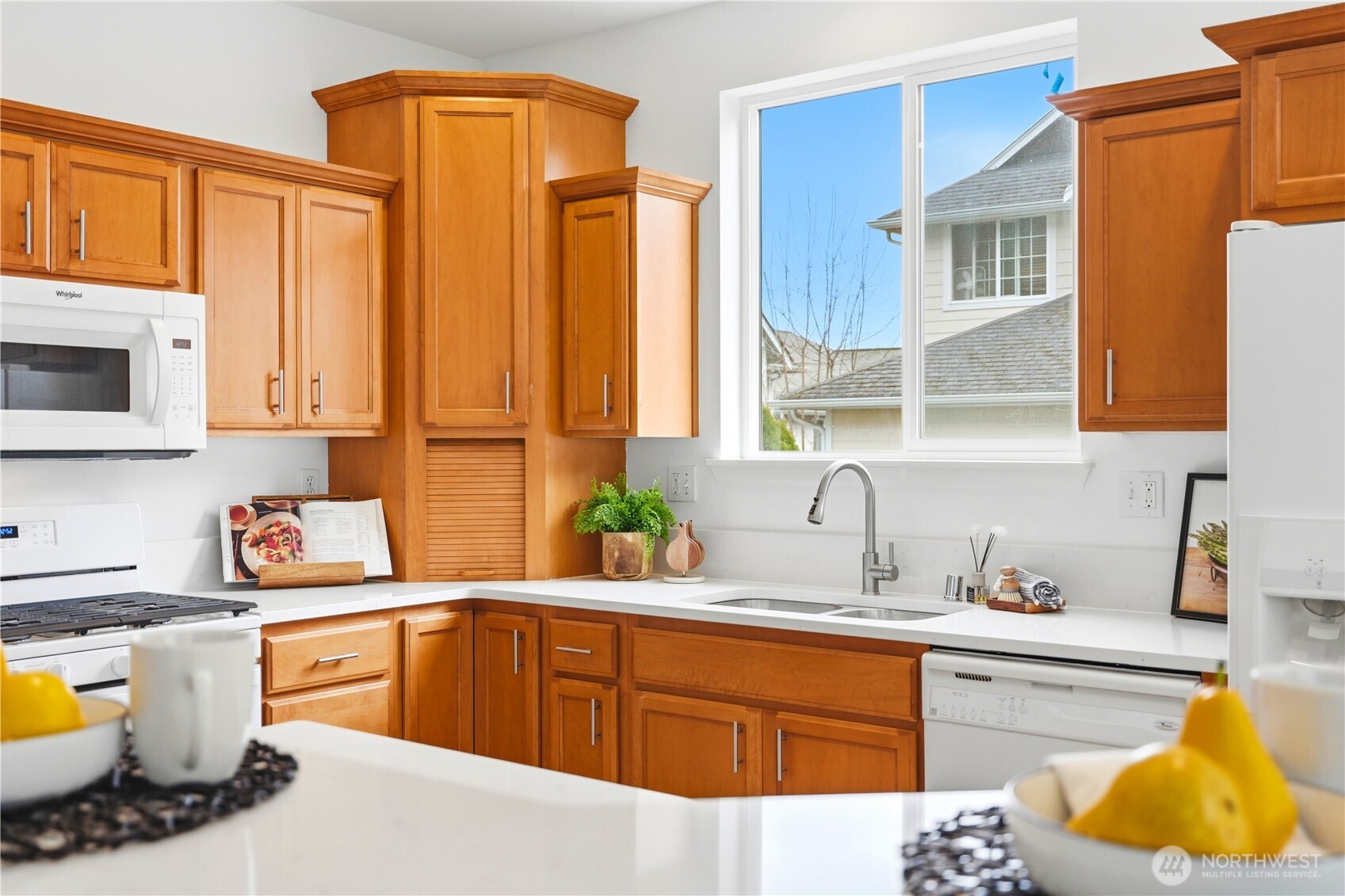 24115 22nd Place West Bothell, WA 98021 - Photo 16 of 40 a kitchen with a sink cabinets and window