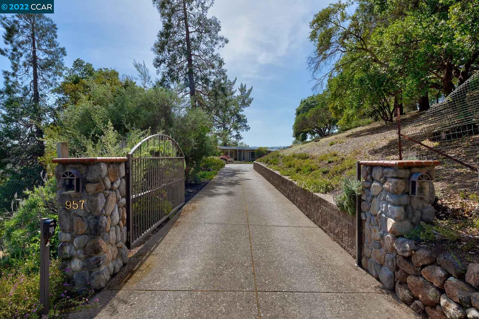 957 Stow Lane Lafayette, CA 94549 - Photo 1 of 1 a view of a pathway with a wrought fence