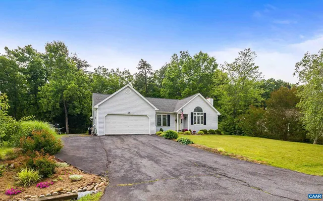 a house view with a garden space