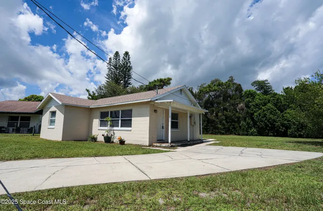 a front view of a house with yard