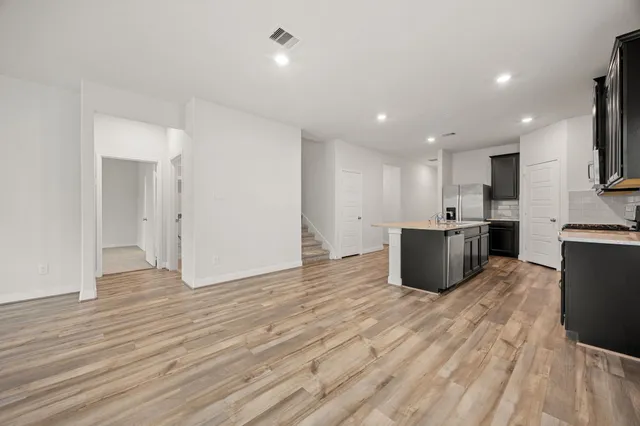 a view of kitchen with wooden floor