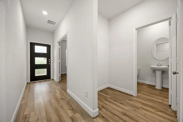 a view of room with window and wooden floor