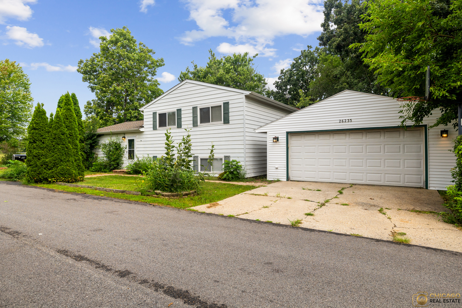 26235 North Acorn Lane Mundelein, IL 60060 - Photo 1 of 24 a front view of a house with a yard and garage