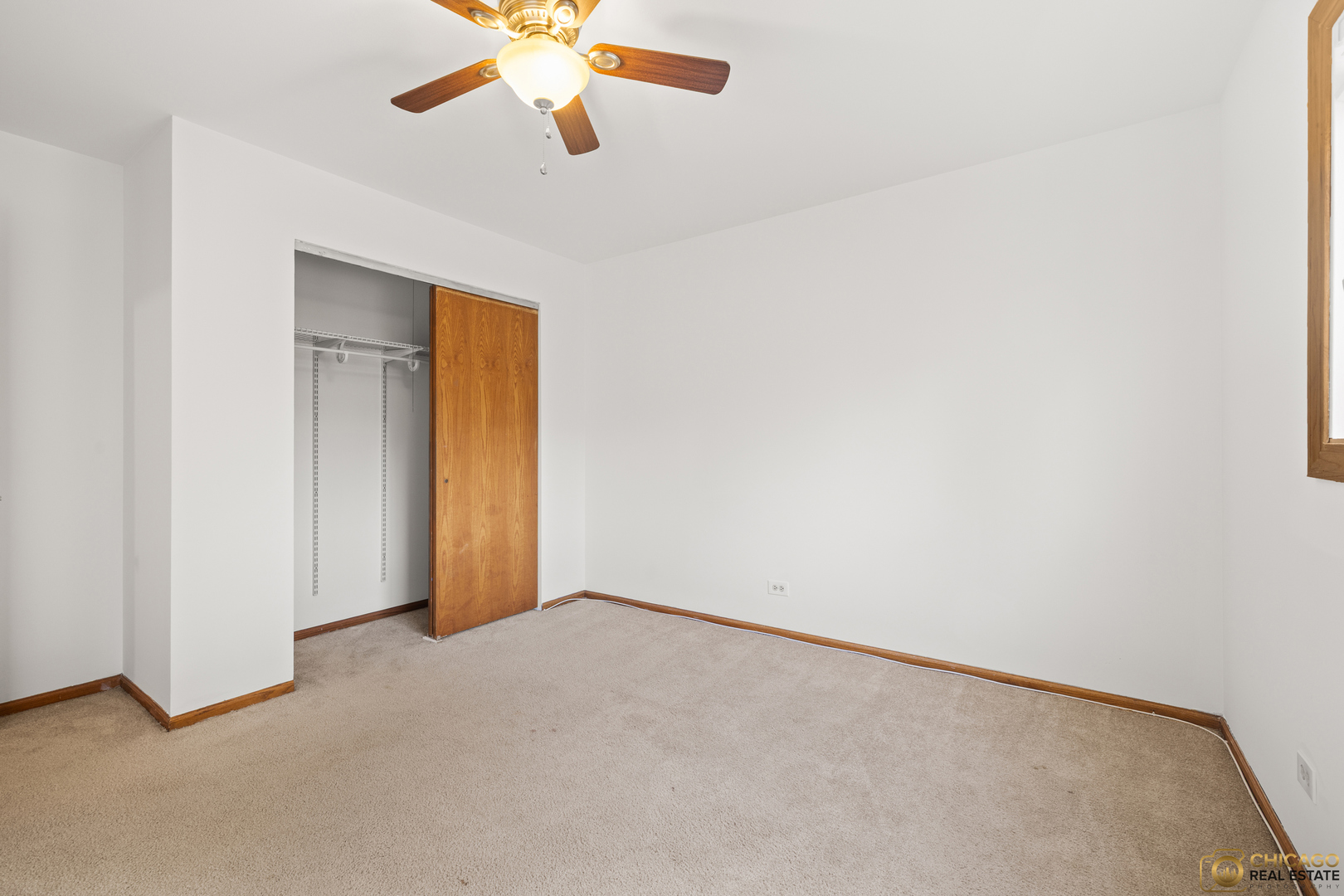 26235 North Acorn Lane Mundelein, IL 60060 - Photo 13 of 24 an empty room with closet and a chandelier fan