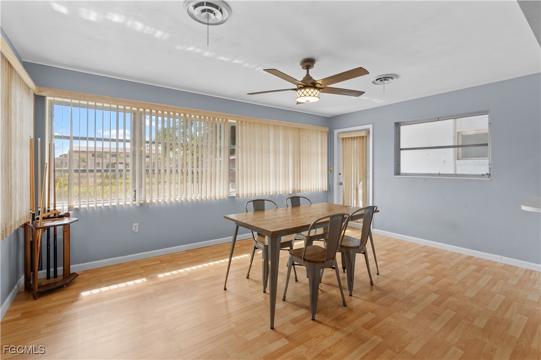 1450 Charles Road Fort Myers, FL 33919 - Photo 11 of 23 a view of a dining room with furniture window and wooden floor