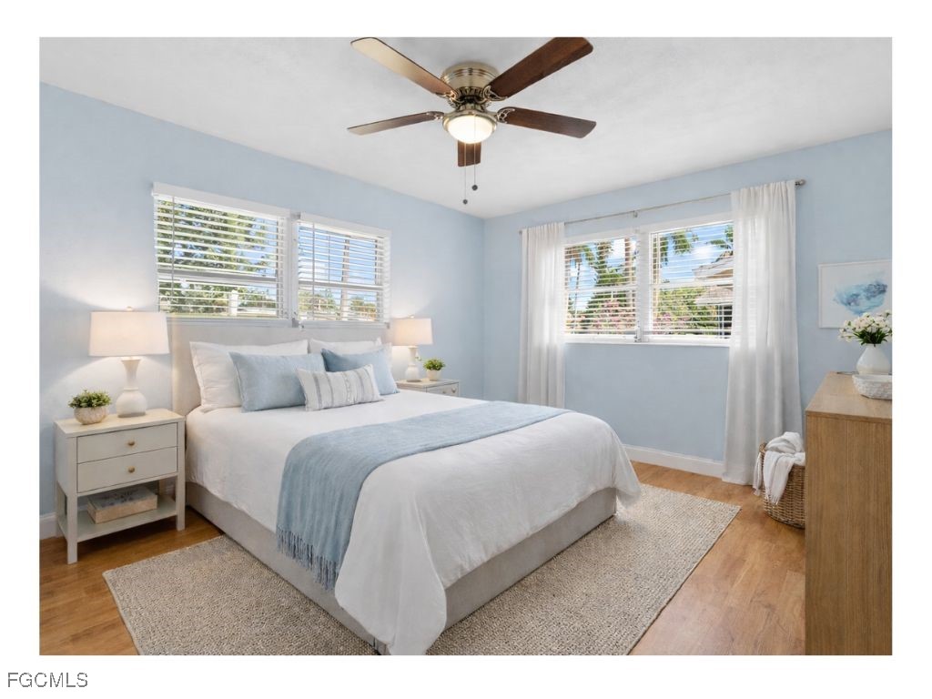 1450 Charles Road Fort Myers, FL 33919 - Photo 12 of 23 a bedroom with a bed and window