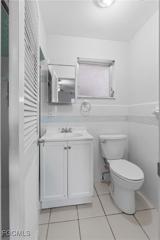 1450 Charles Road Fort Myers, FL 33919 - Photo 16 of 23 a bathroom with a sink toilet and mirror