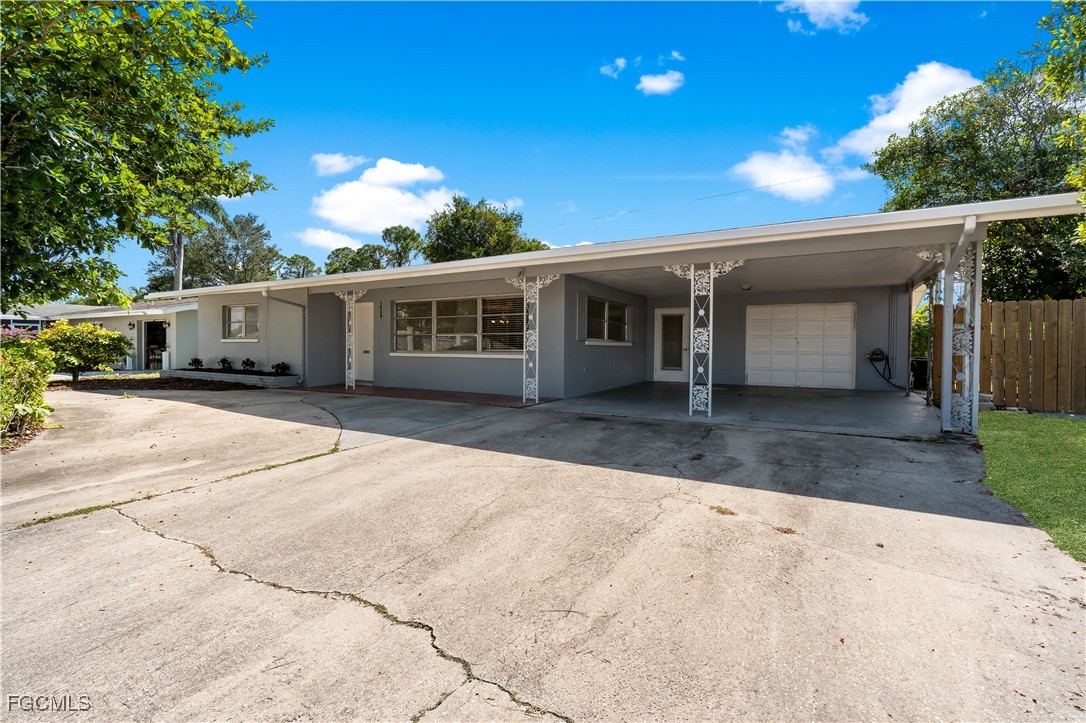 1450 Charles Road Fort Myers, FL 33919 - Photo 20 of 23 a view of a house with a patio
