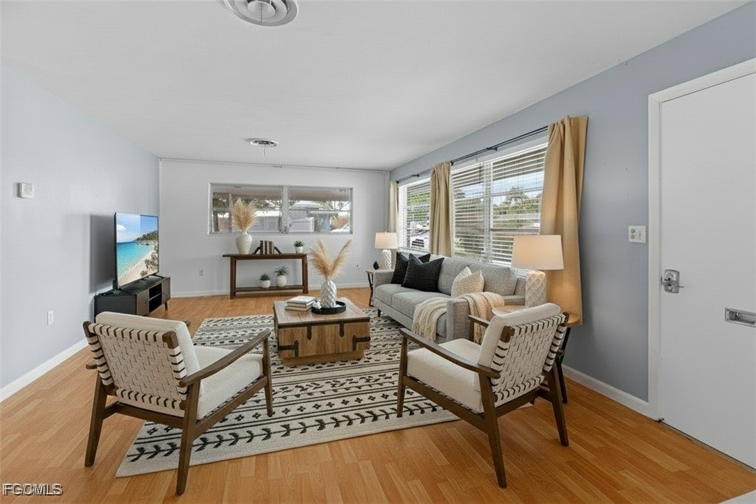 1450 Charles Road Fort Myers, FL 33919 - Photo 2 of 23 a living room with furniture and a window