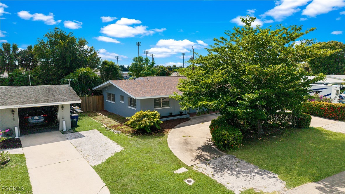 1450 Charles Road Fort Myers, FL 33919 - Photo 21 of 23 a view of a house with a backyard