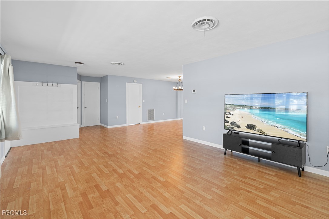 1450 Charles Road Fort Myers, FL 33919 - Photo 6 of 23 a view of kitchen with wooden floor and electronic appliances