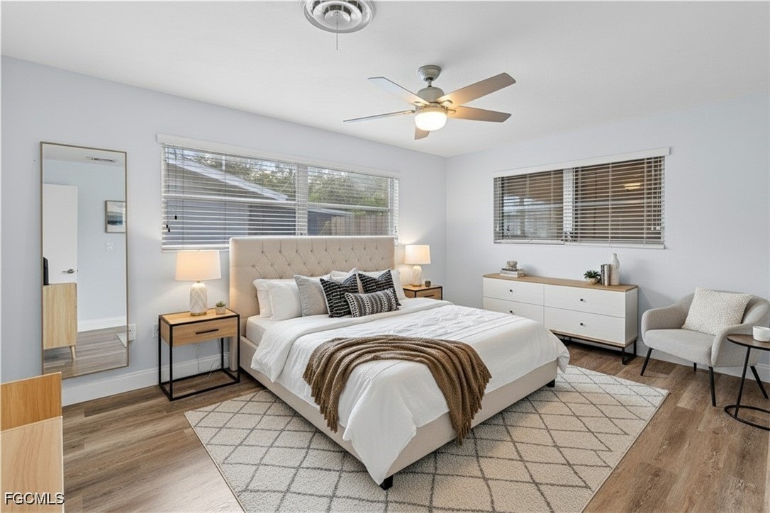 1450 Charles Road Fort Myers, FL 33919 - Photo 8 of 23 a bedroom with a large bed and a window