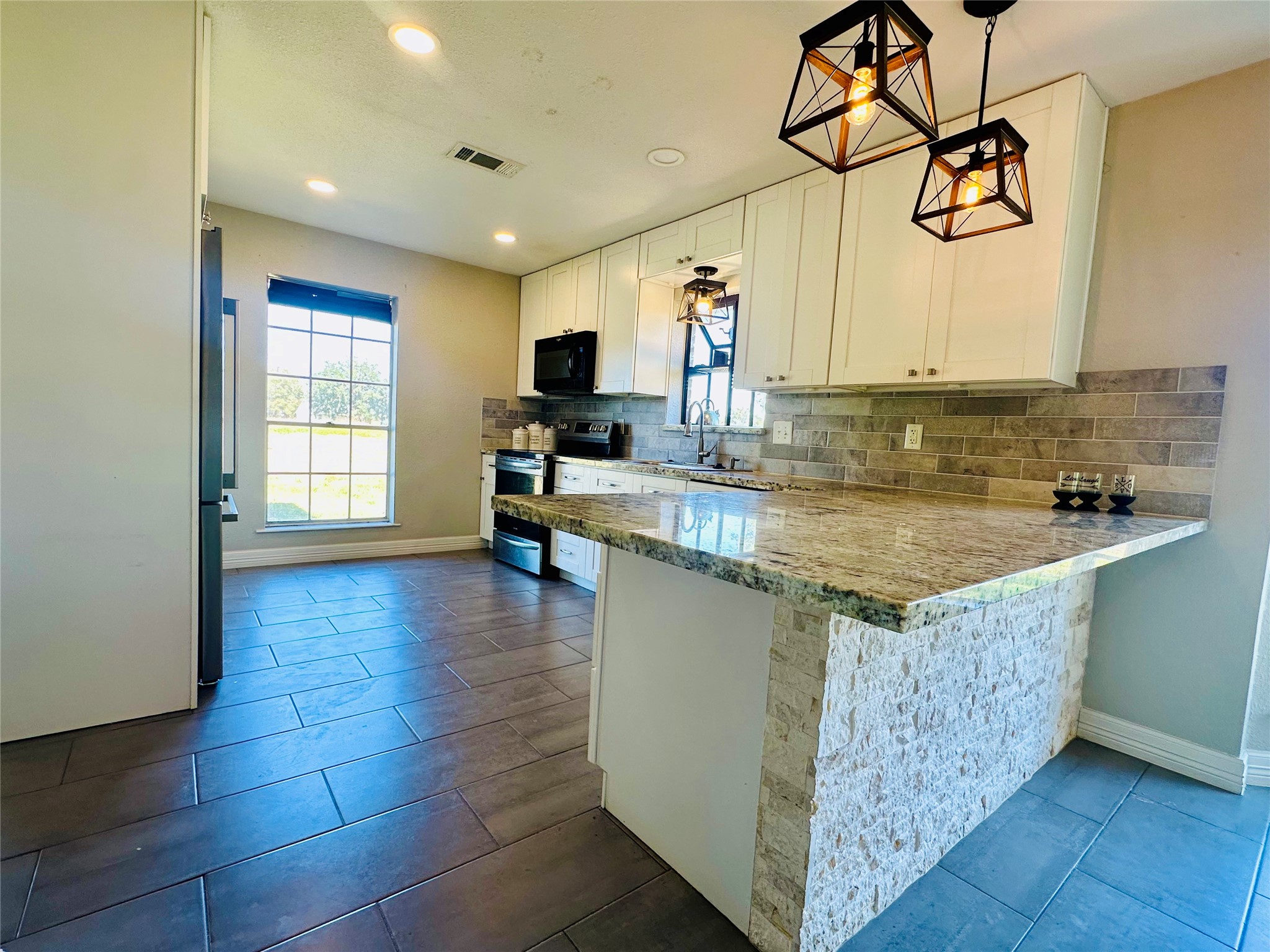 20257 Highway 35 Sweeny, TX 77480 - Photo 9 of 21 Stone Accent with Warm Lighting