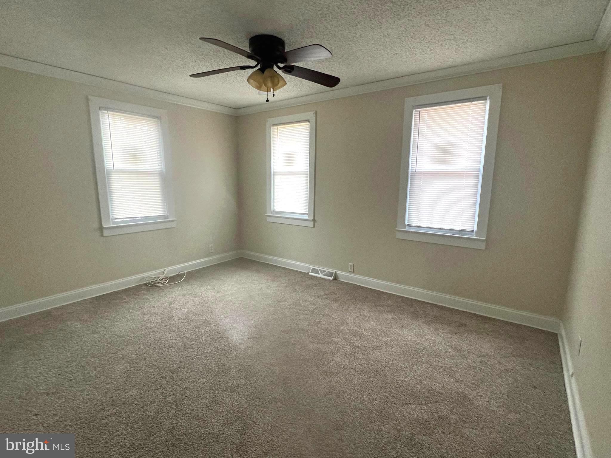 301 Pemberton Road Southampton, NJ 08088 - Photo 15 of 29 an empty room with a window and a fan