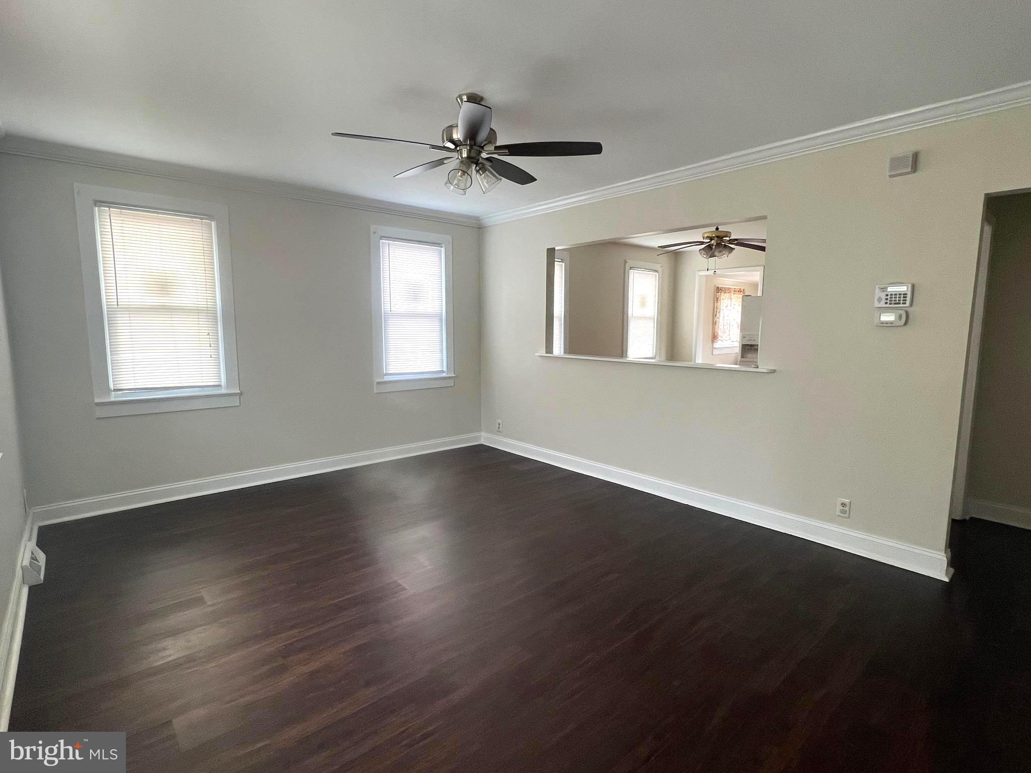 301 Pemberton Road Southampton, NJ 08088 - Photo 2 of 29 a view of an empty room with wooden floor and a window