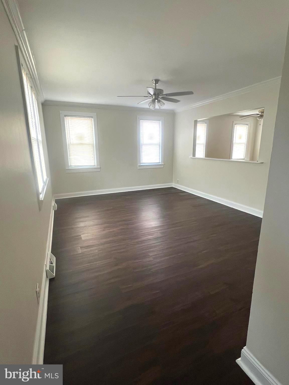 301 Pemberton Road Southampton, NJ 08088 - Photo 3 of 29 an empty room with wooden floor and windows