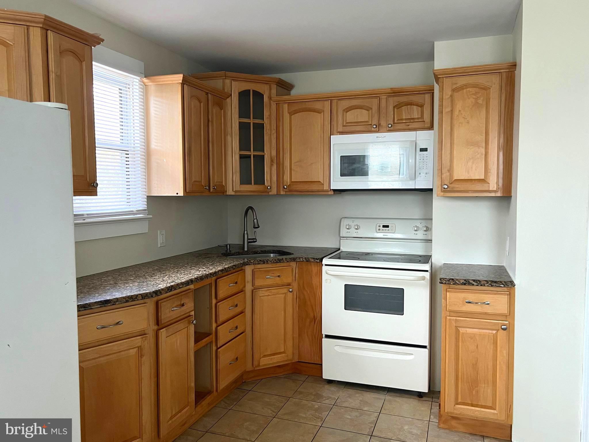 301 Pemberton Road Southampton, NJ 08088 - Photo 6 of 29 a kitchen with stainless steel appliances granite countertop a sink and cabinets