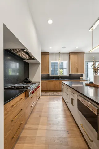 a dining room with furniture window and wooden floor