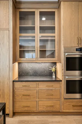 a spacious bedroom with a bed and a chandelier