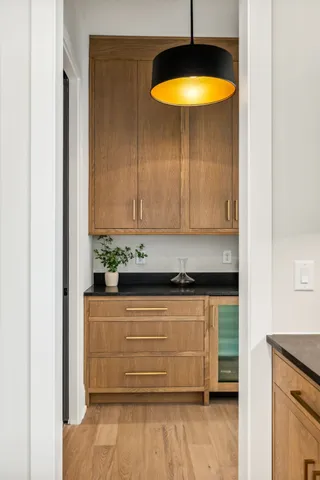a bedroom with a large bed and a chandelier