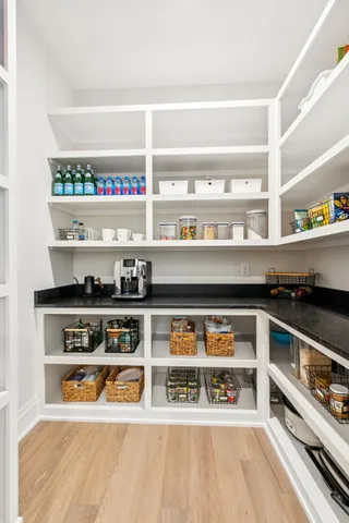 a spacious bathroom with a tub sink and mirror