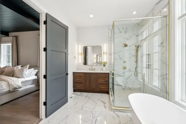 a spacious bathroom with a double vanity sink and a mirror