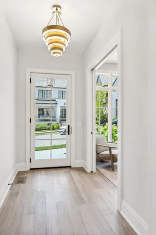 a living room with a table and chairs