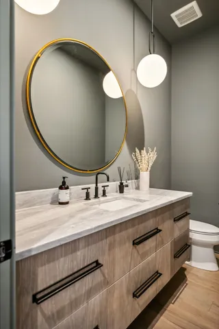 a living room with furniture a fireplace and kitchen view