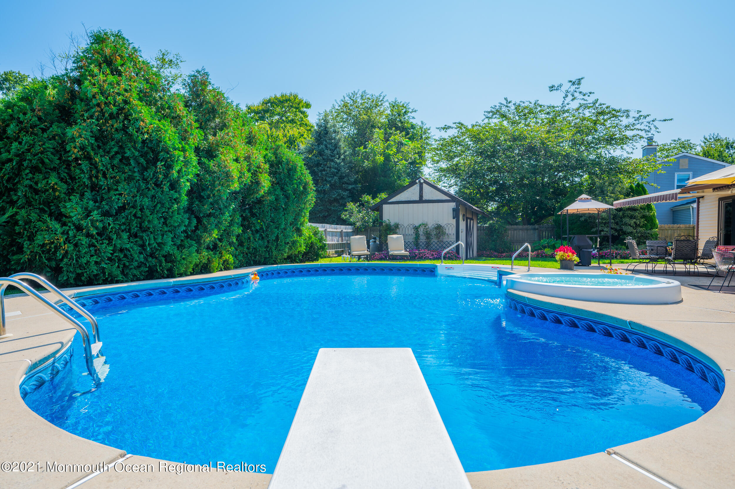 7 New Friendship Road Howell, NJ 07731 - Photo 14 of 26 a view of swimming pool with a lounge chairs