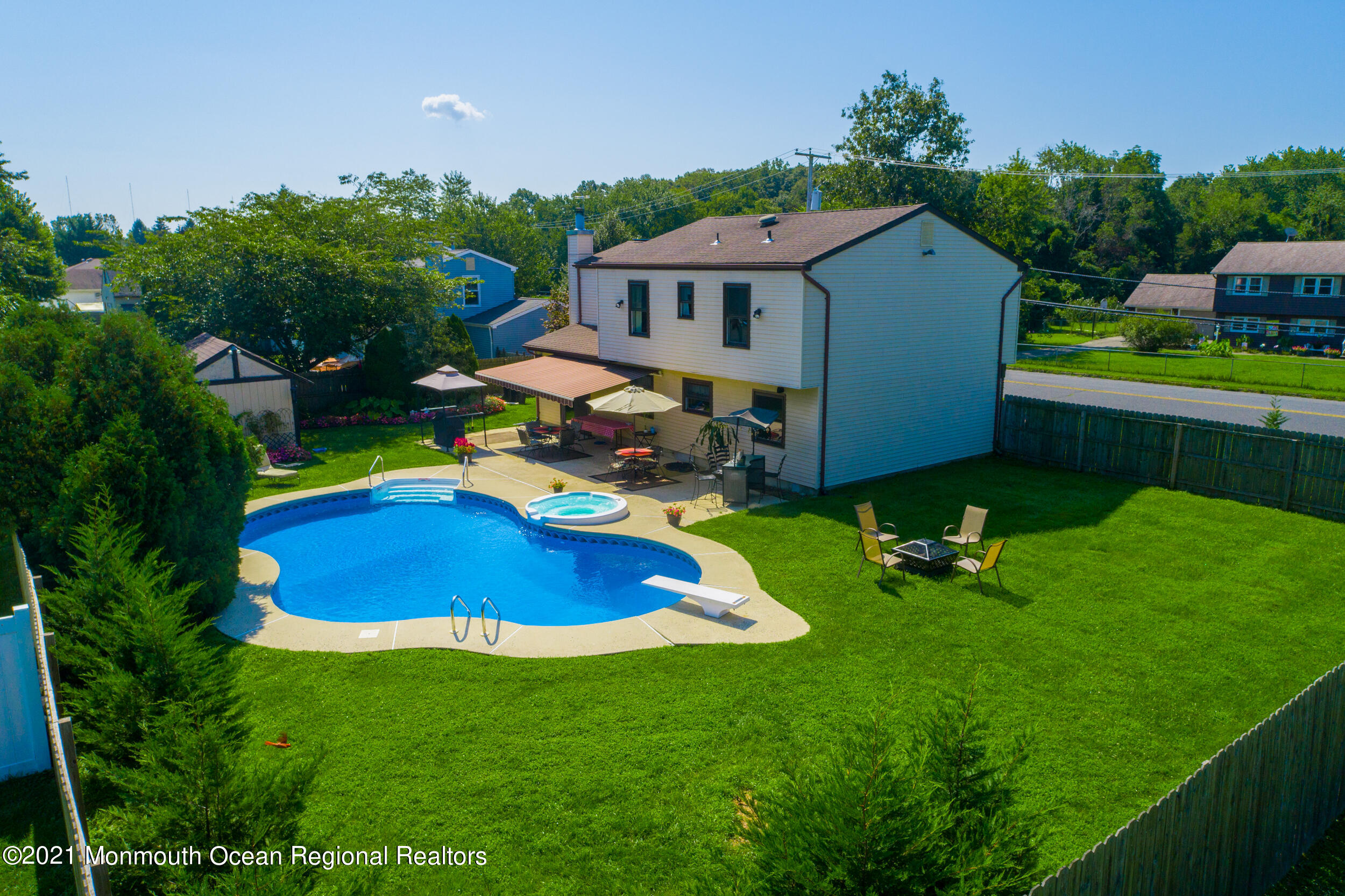 7 New Friendship Road Howell, NJ 07731 - Photo 16 of 26 a aerial view of a house with swimming pool a yard and lake view