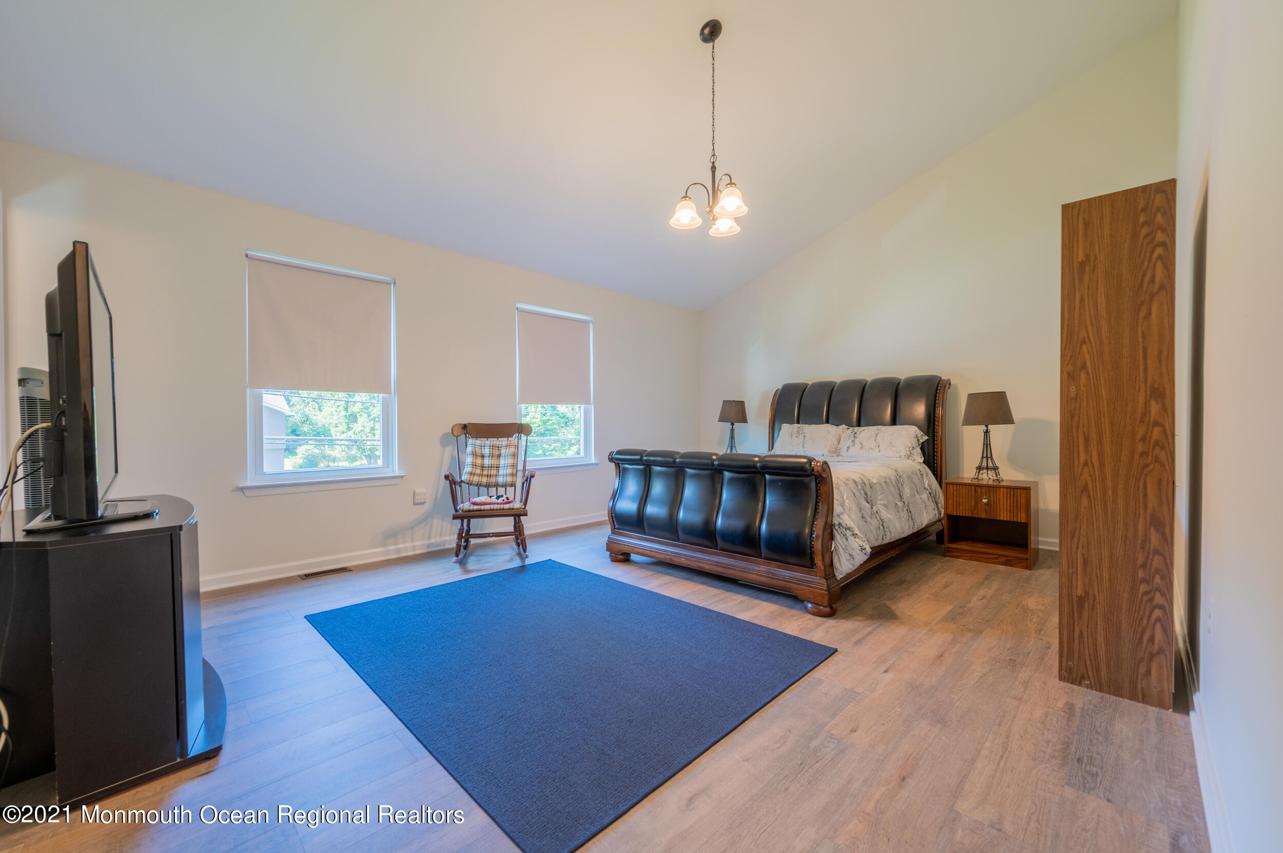 7 New Friendship Road Howell, NJ 07731 - Photo 19 of 26 a living room with furniture and a flat screen tv