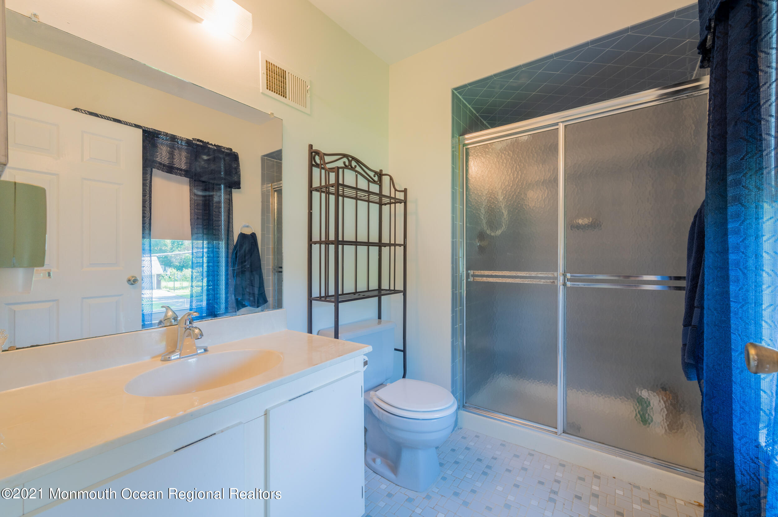 7 New Friendship Road Howell, NJ 07731 - Photo 20 of 26 a bathroom with a sink and a large mirror