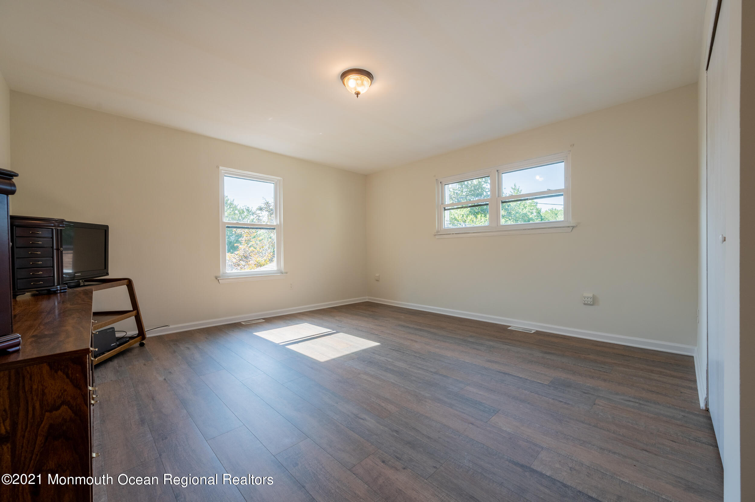 7 New Friendship Road Howell, NJ 07731 - Photo 24 of 26 wooden floor in an empty room with a window