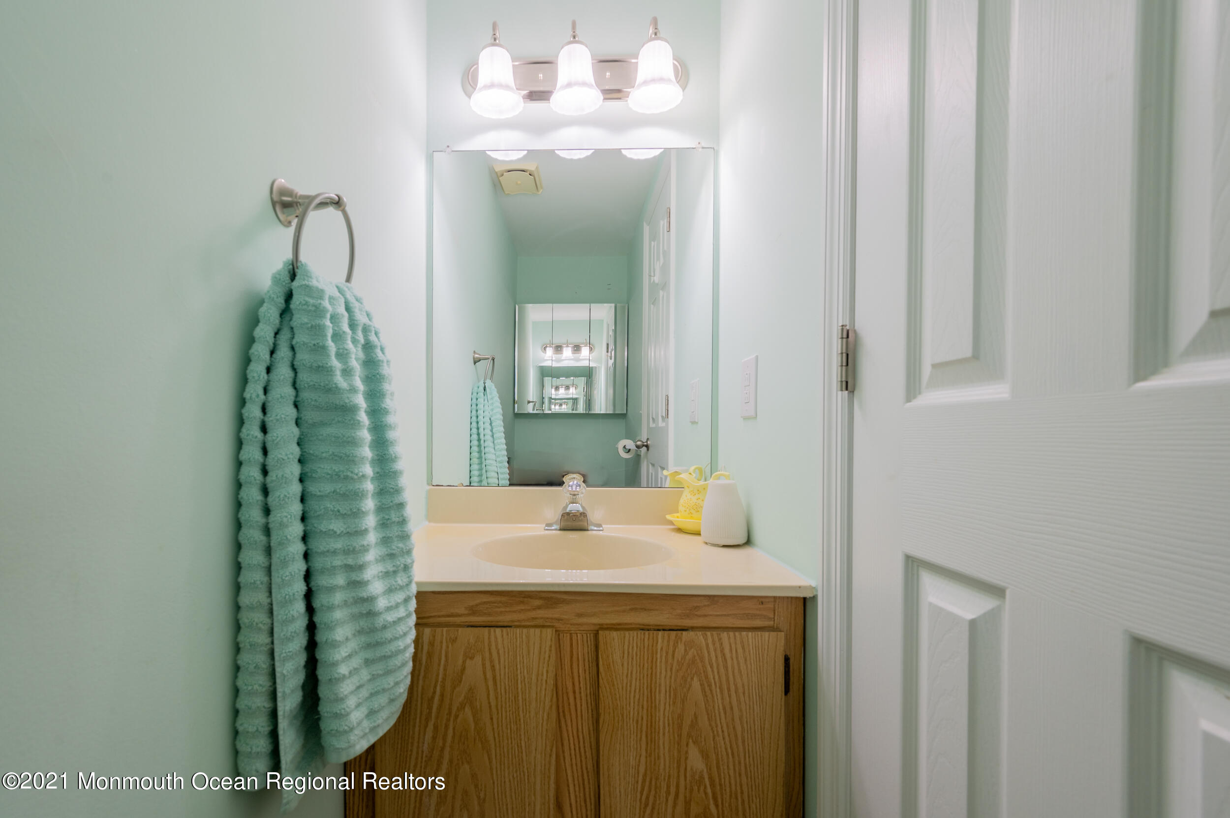 7 New Friendship Road Howell, NJ 07731 - Photo 4 of 26 a bathroom with a sink a mirror and vanity