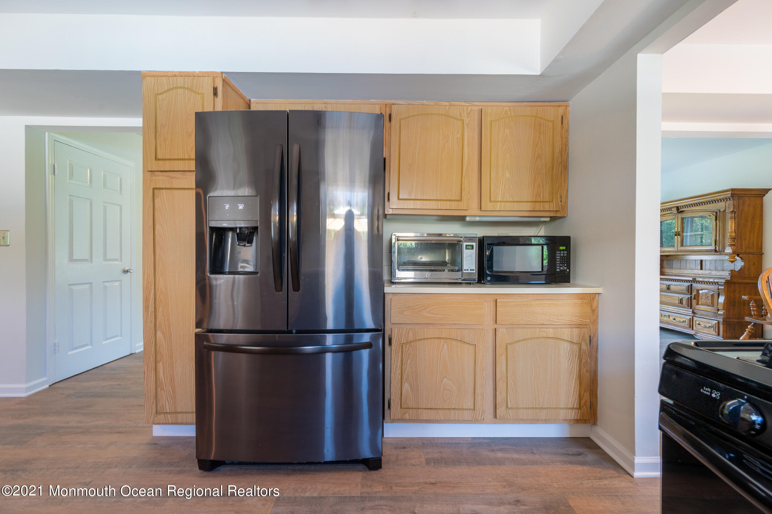 7 New Friendship Road Howell, NJ 07731 - Photo 7 of 26 a kitchen with stainless steel appliances granite countertop a refrigerator and a stove top oven