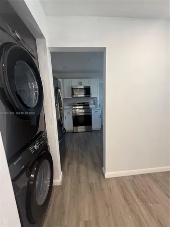 a view of a kitchen with washer and dryer