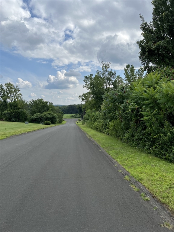 2 Hummell Lane Southwick, MA 01077 - Photo 2 of 3 a view of a road with a yard