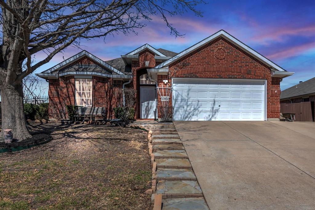 201 Foreston Drive Roanoke, TX 76262 - Photo 1 of 1 View of front of house with concrete driveway, brick siding, fence, and an attached garage