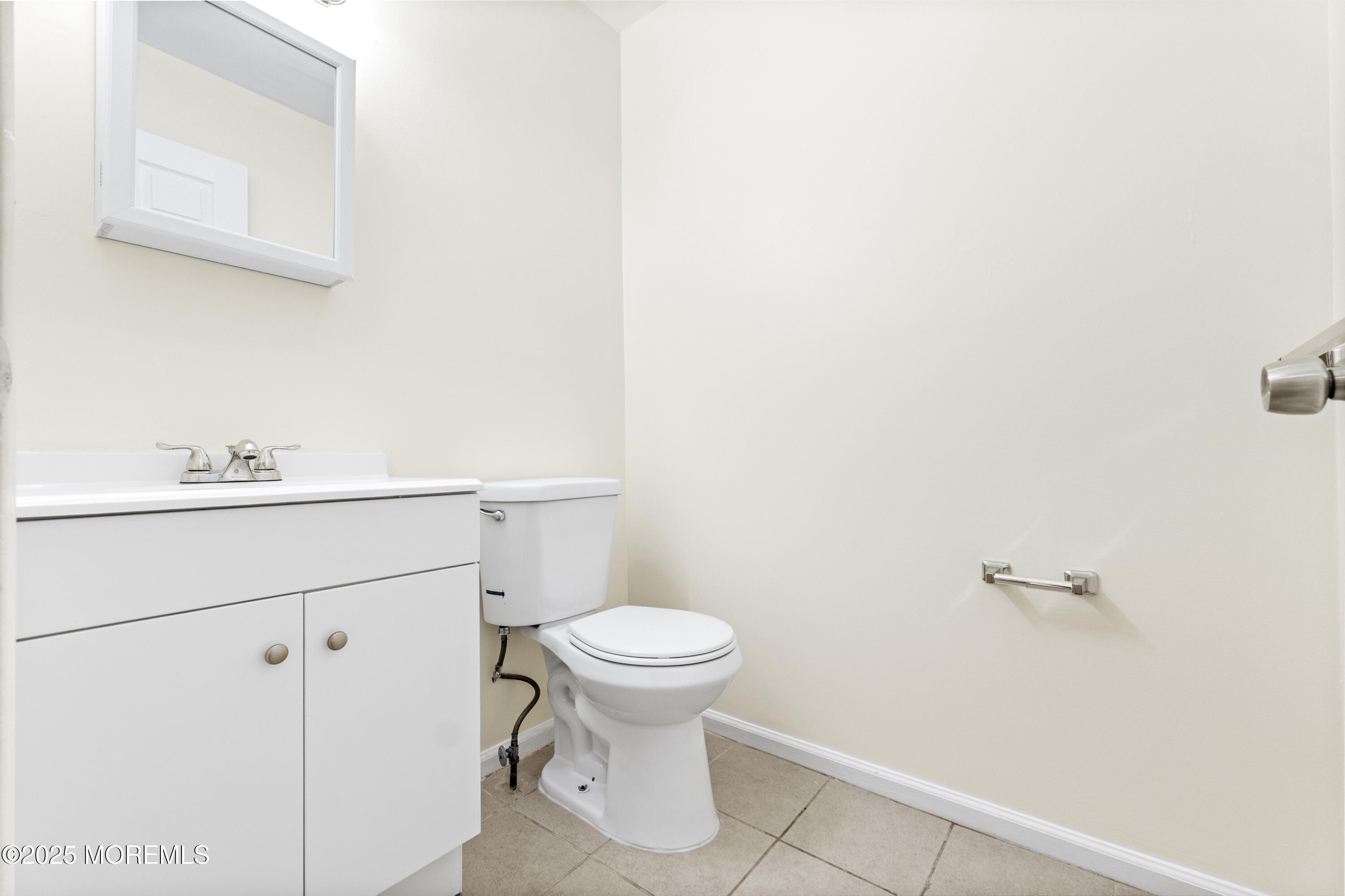 12 Carmella Court Newark, NJ 07104 - Photo 11 of 41 a bathroom with a sink a toilet and a mirror