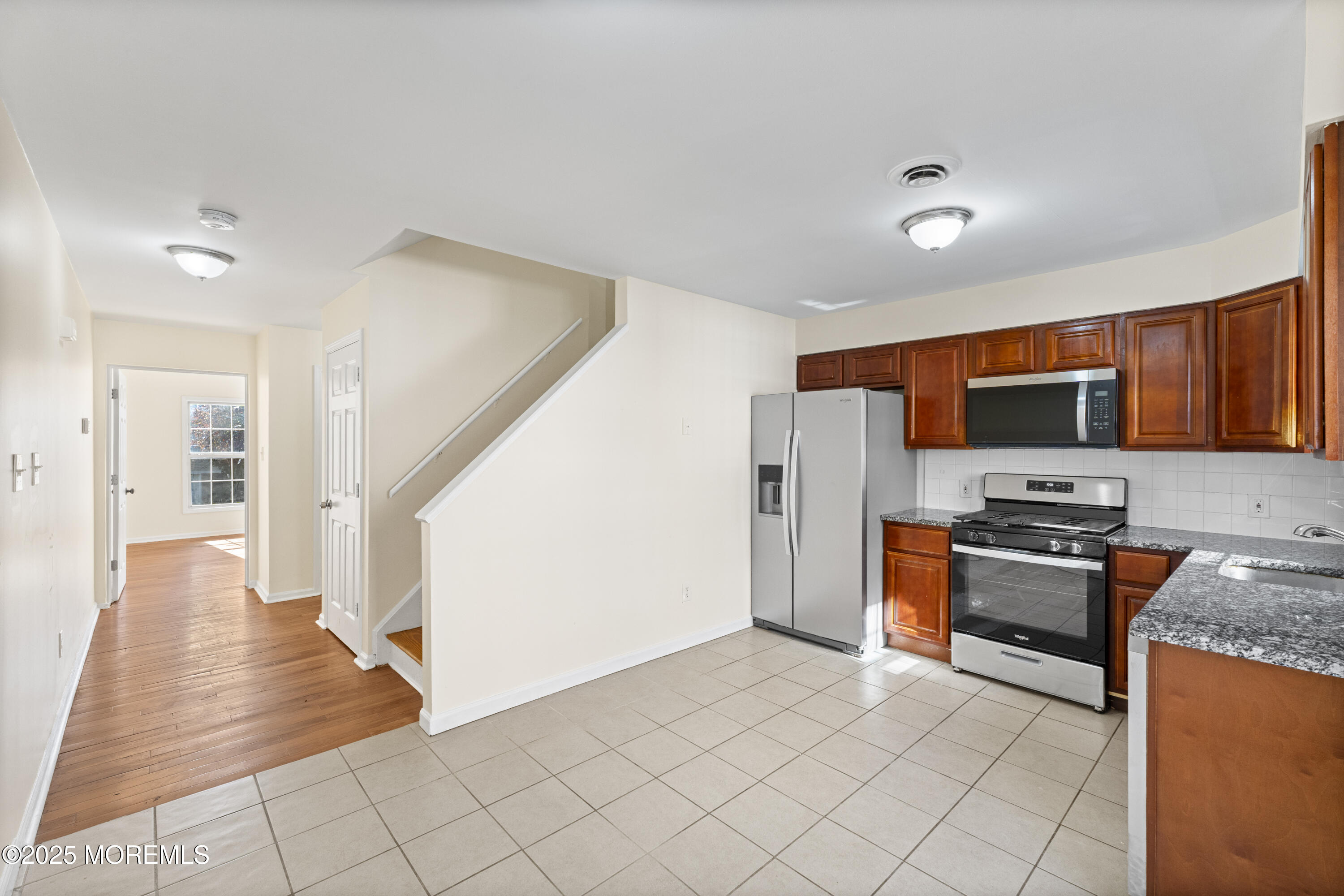 12 Carmella Court Newark, NJ 07104 - Photo 15 of 41 a kitchen with stainless steel appliances granite countertop a refrigerator and a stove top oven