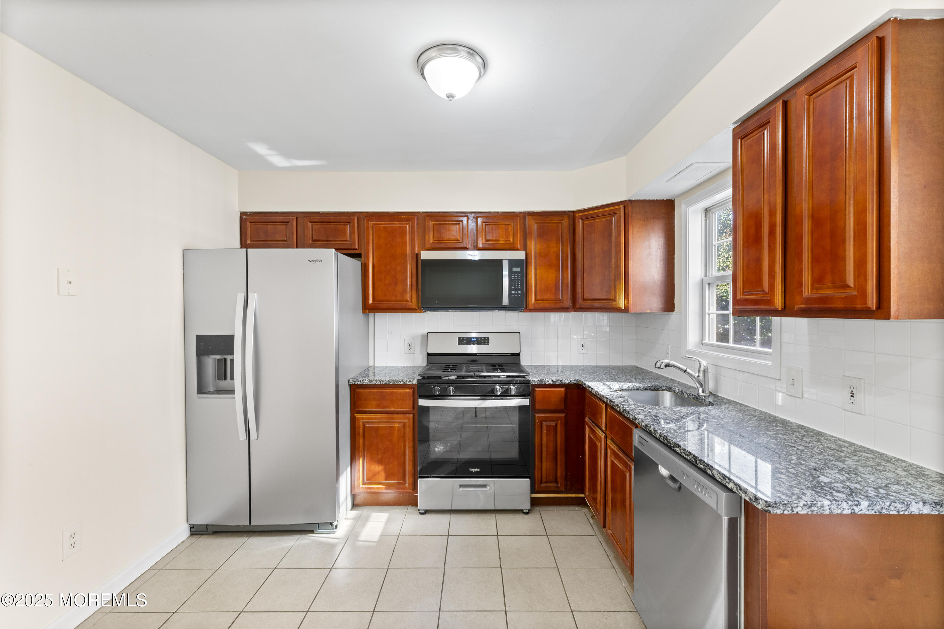 12 Carmella Court Newark, NJ 07104 - Photo 16 of 41 a kitchen with stainless steel appliances granite countertop a refrigerator stove and sink