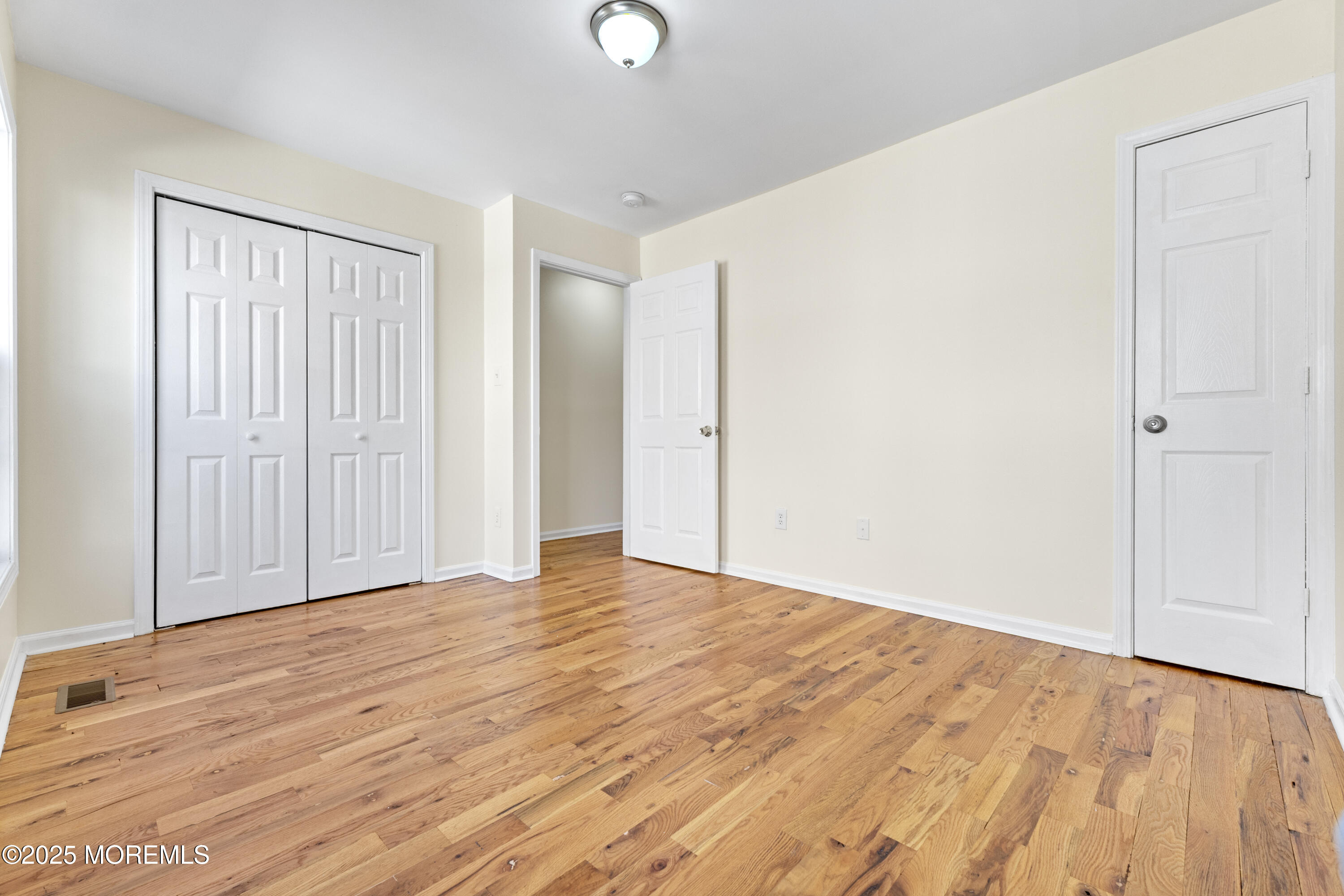 12 Carmella Court Newark, NJ 07104 - Photo 30 of 41 a view of an empty room with wooden floor