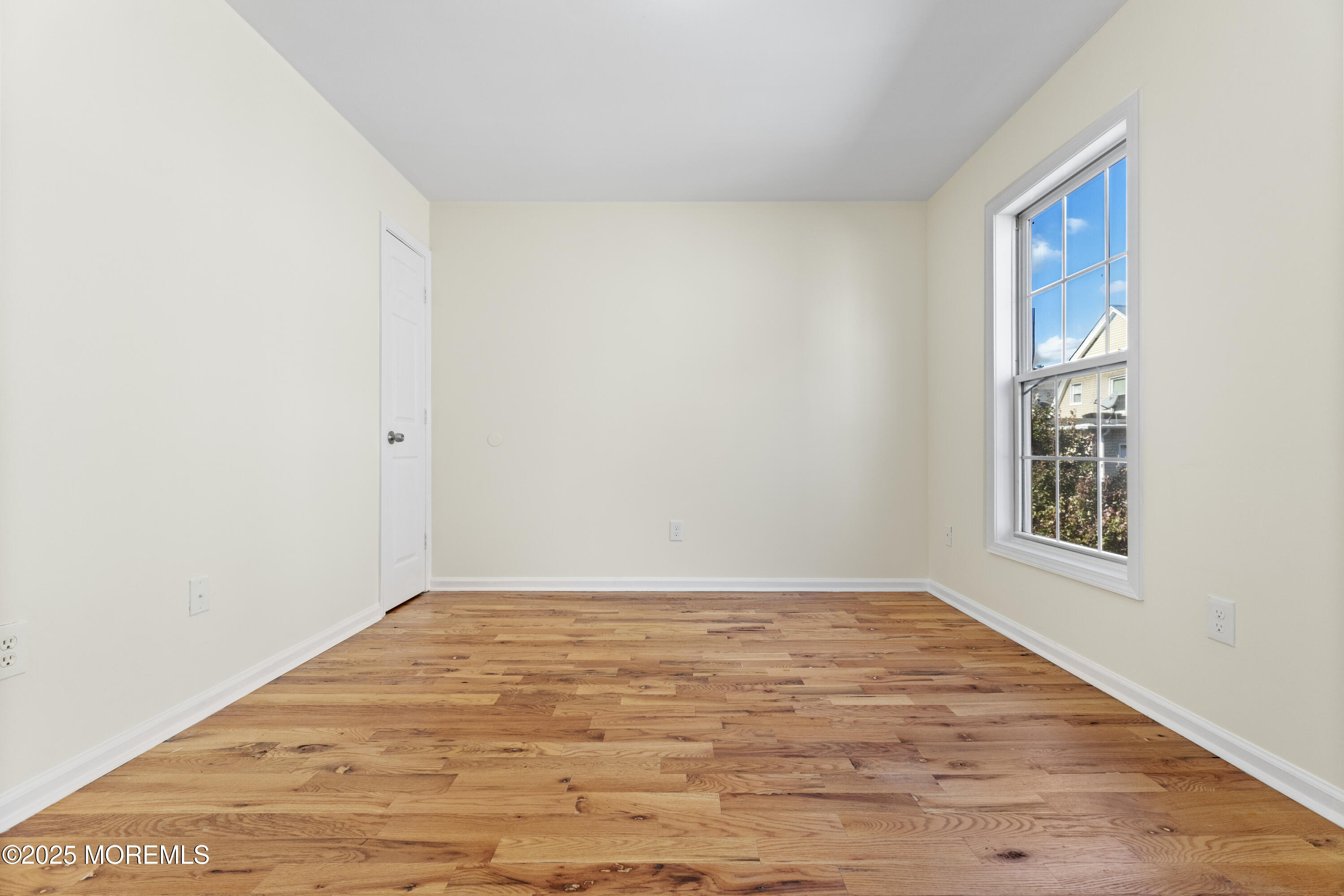 12 Carmella Court Newark, NJ 07104 - Photo 32 of 41 a view of empty room with wooden floor and fan