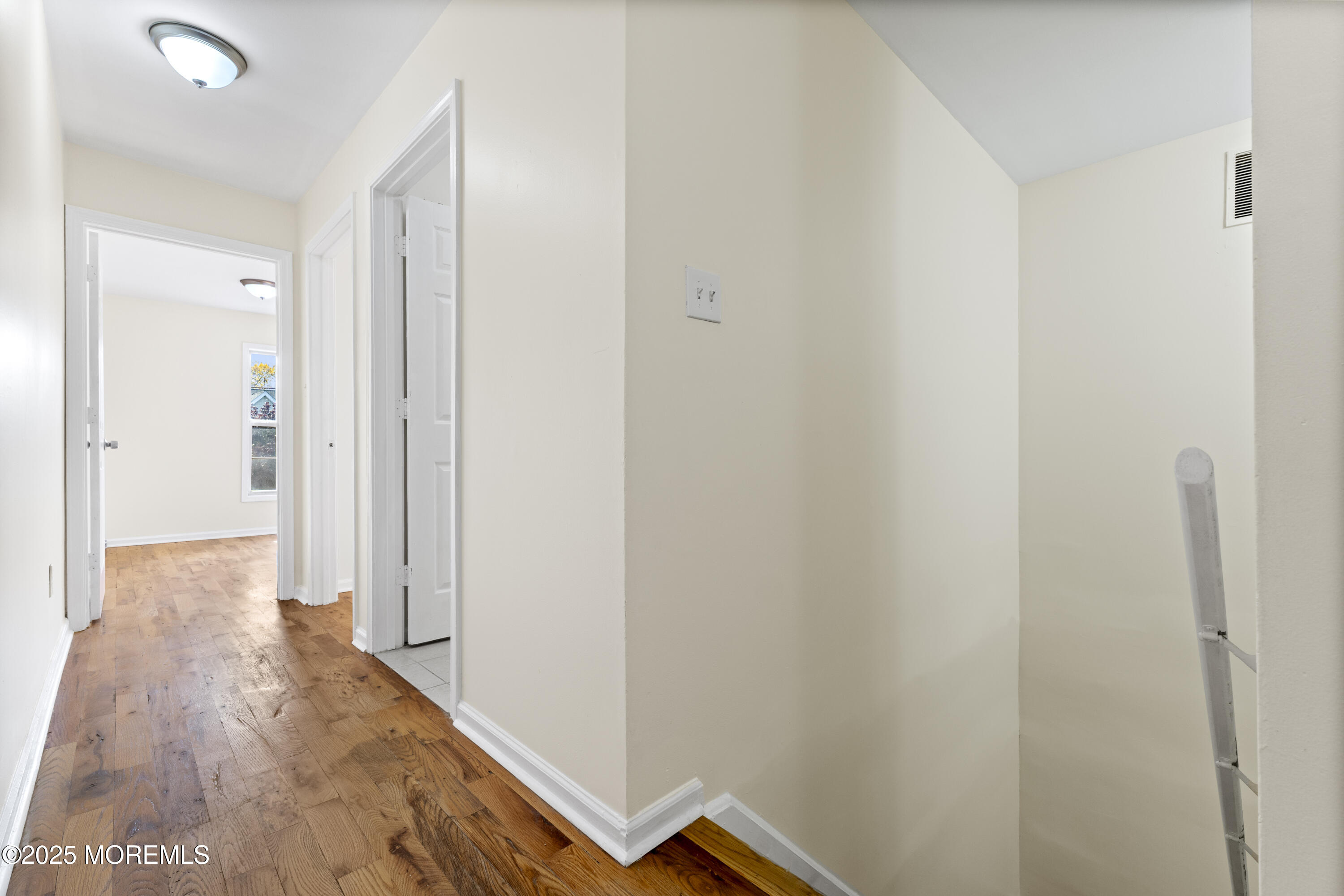 12 Carmella Court Newark, NJ 07104 - Photo 33 of 41 a view of a hallway with wooden floor