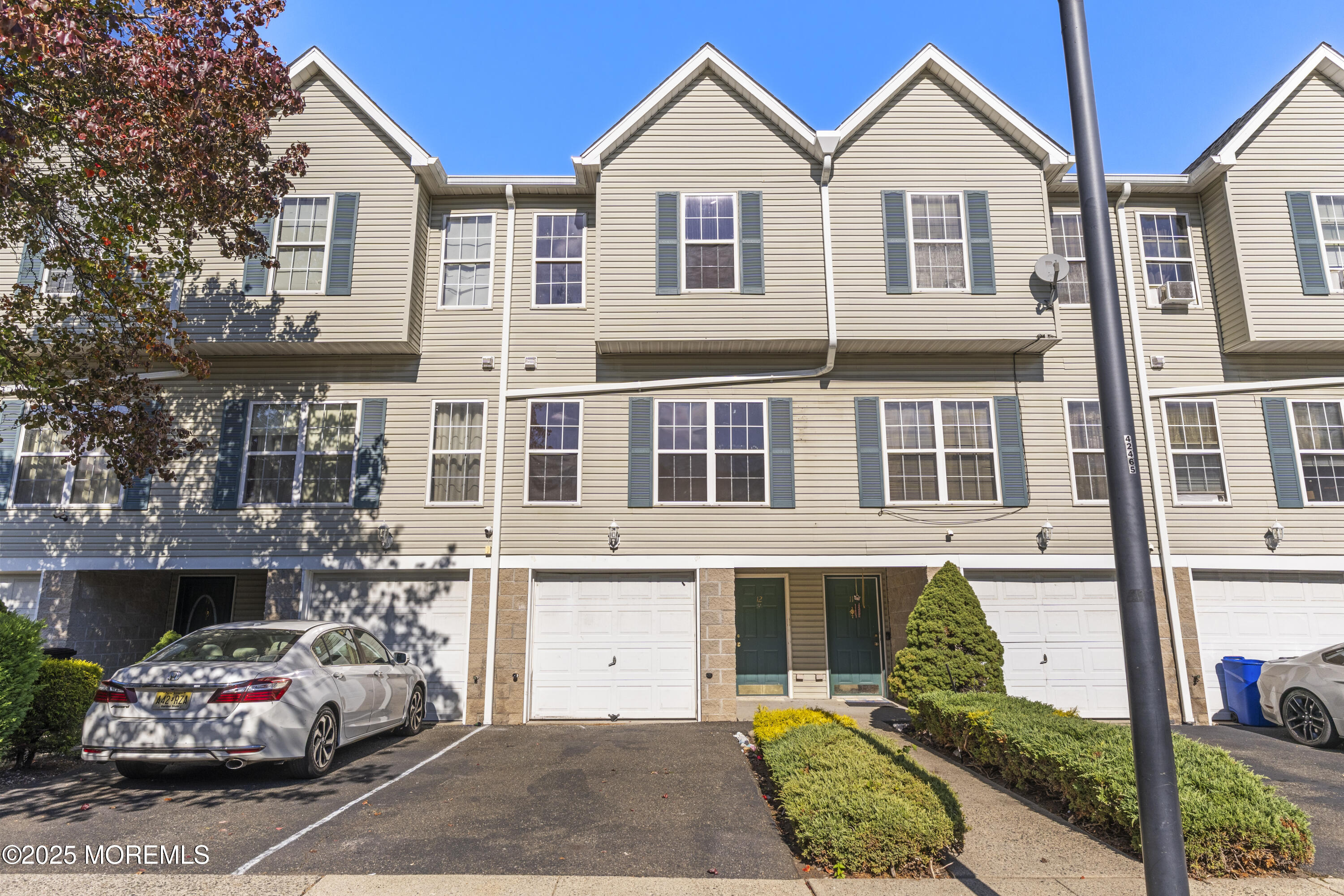 12 Carmella Court Newark, NJ 07104 - Photo 37 of 41 a front view of a house with a garden