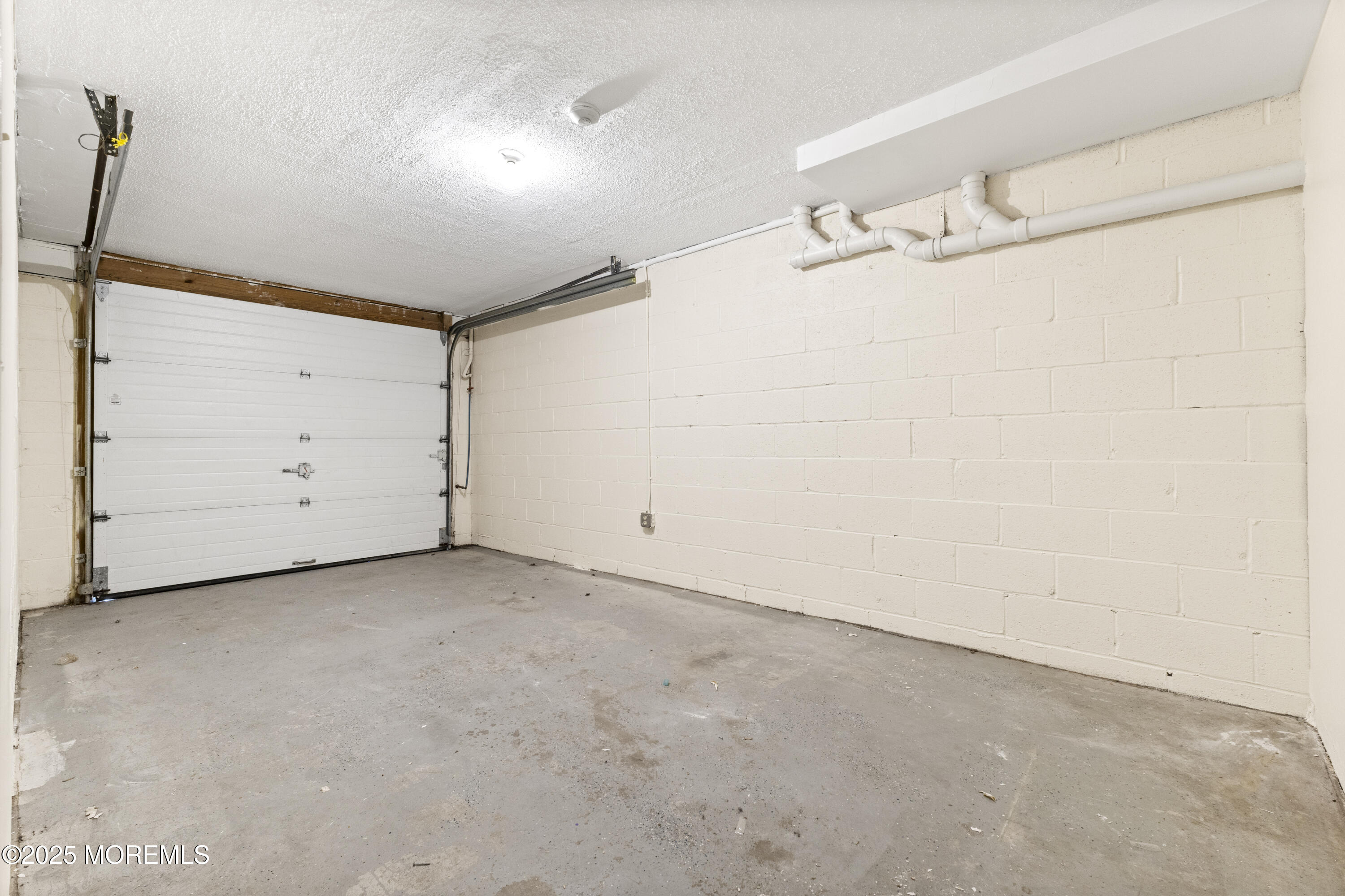12 Carmella Court Newark, NJ 07104 - Photo 40 of 41 a view of a room with racks on the wall
