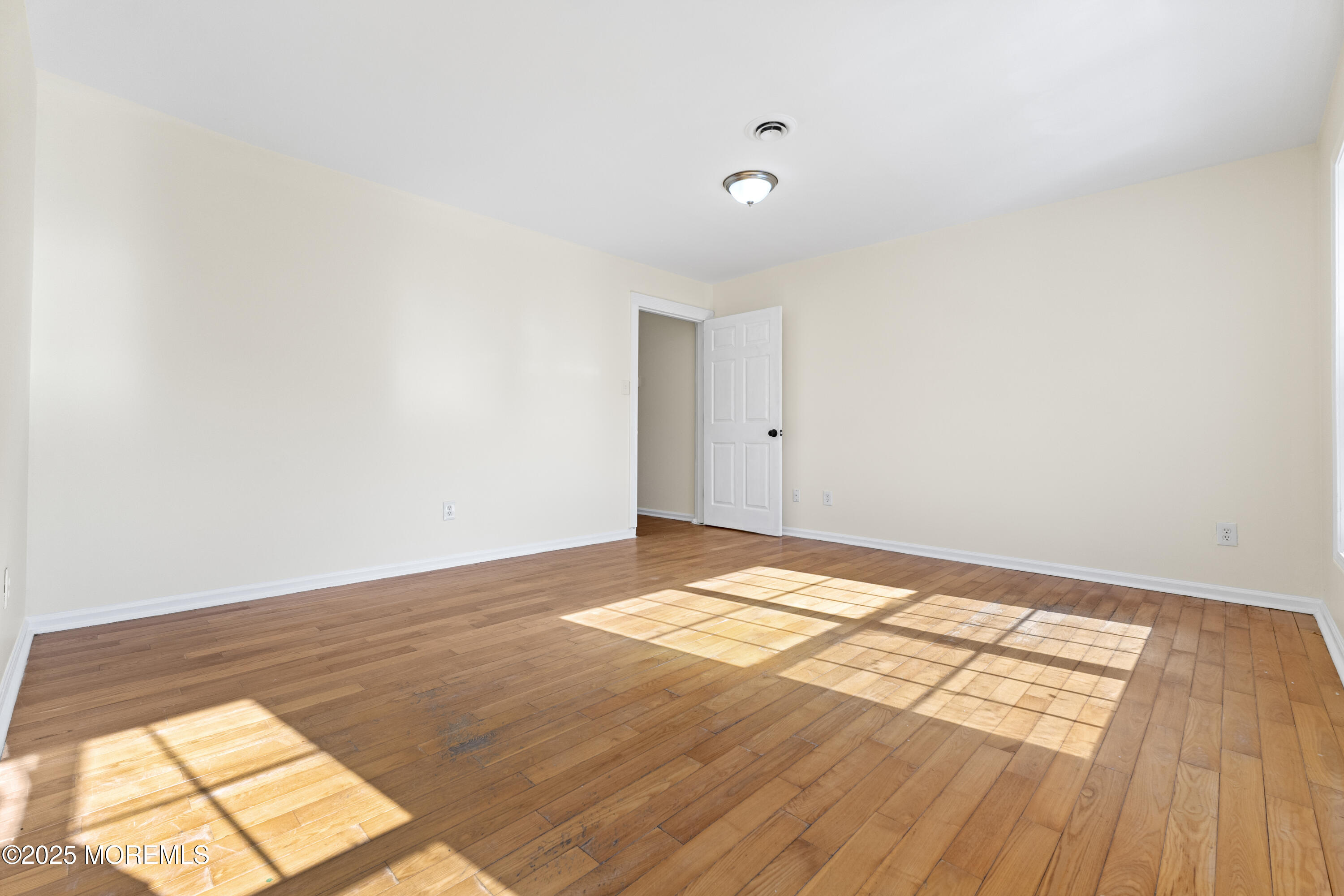12 Carmella Court Newark, NJ 07104 - Photo 9 of 41 a view of an empty room and wooden floor