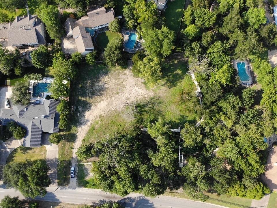 an aerial view of residential house with green space
