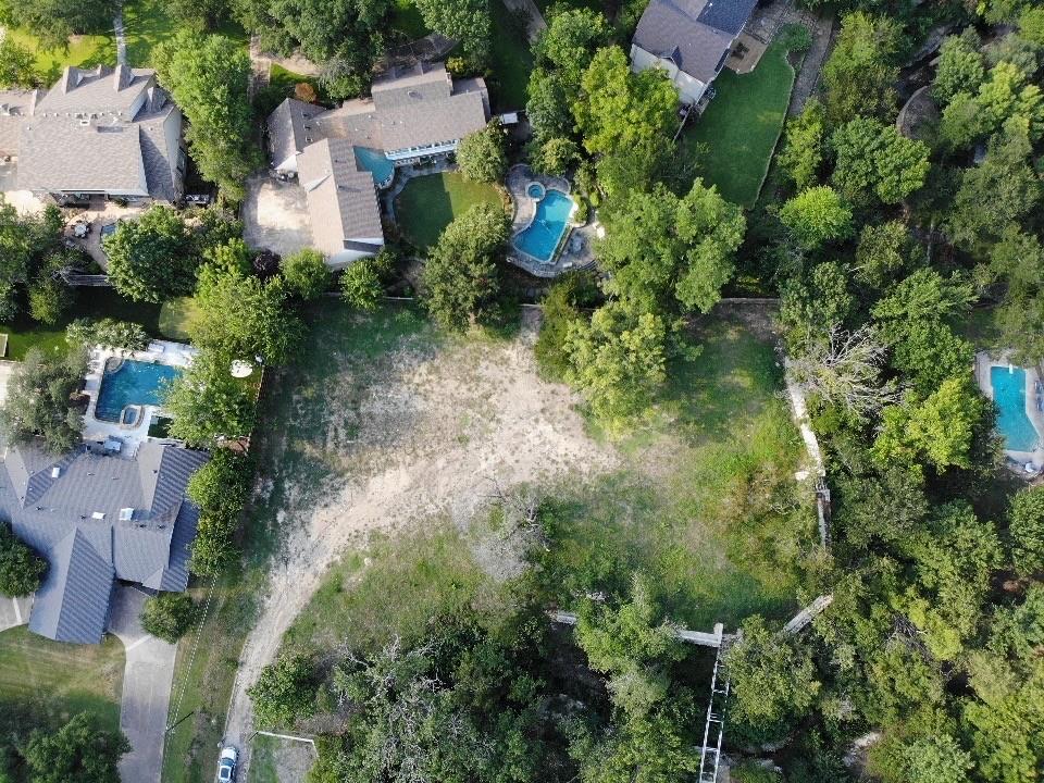 7121 Spring Valley Road Dallas, TX 75254 - Photo 2 of 3 an aerial view of residential house with outdoor space and trees all around