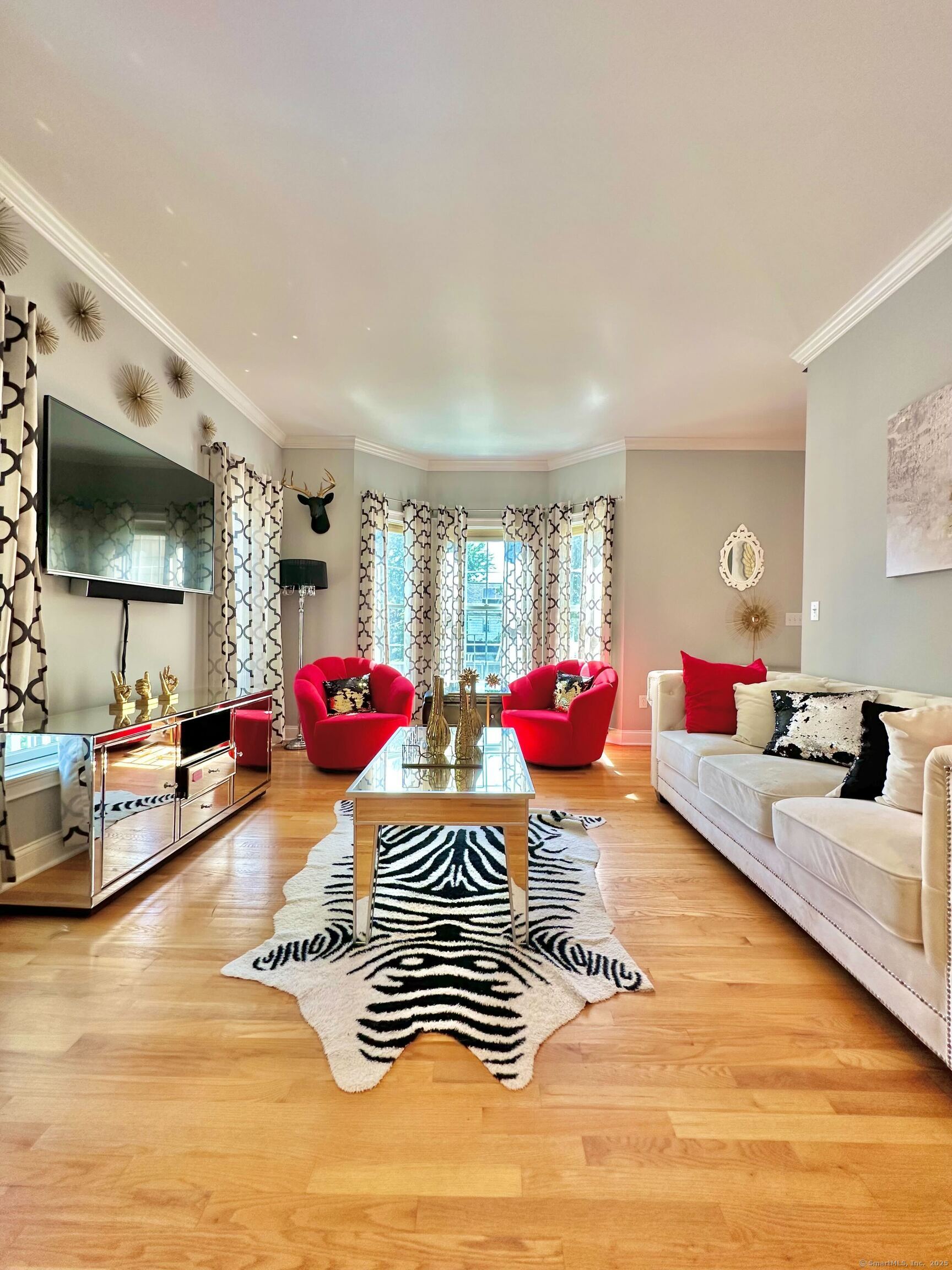 564 Black Rock Turnpike, Unit 564 Fairfield, CT 06825 - Photo 1 of 24 a living room with furniture and a flat screen tv